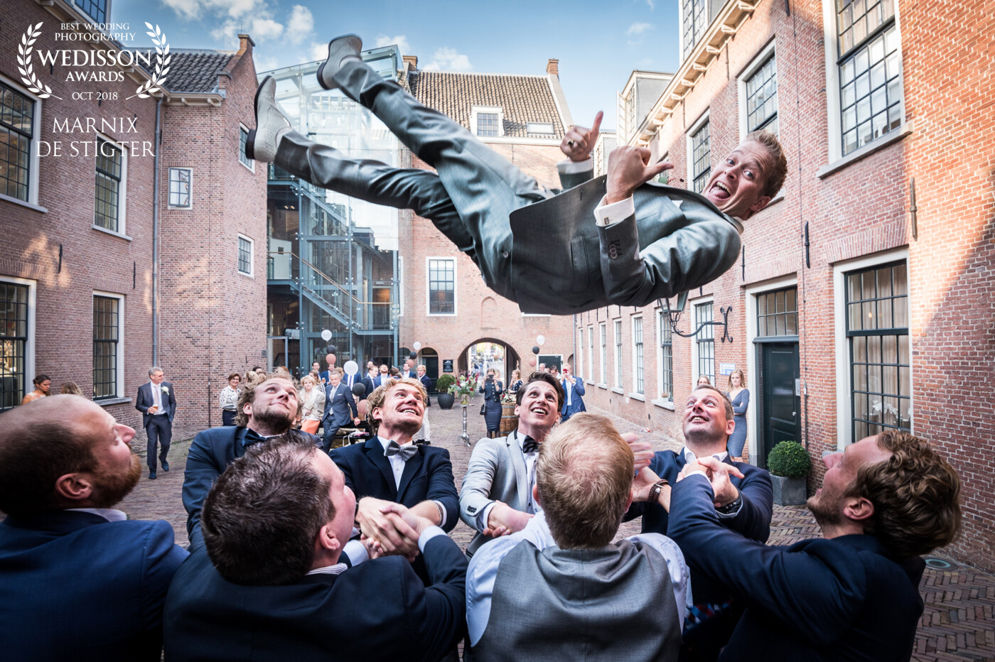 Without any seeming effort these groomsmen made the groom fly really high. I had never seen a groom be this relaxed and enjoy this as much as he did. Love the expression on all the men's faces!