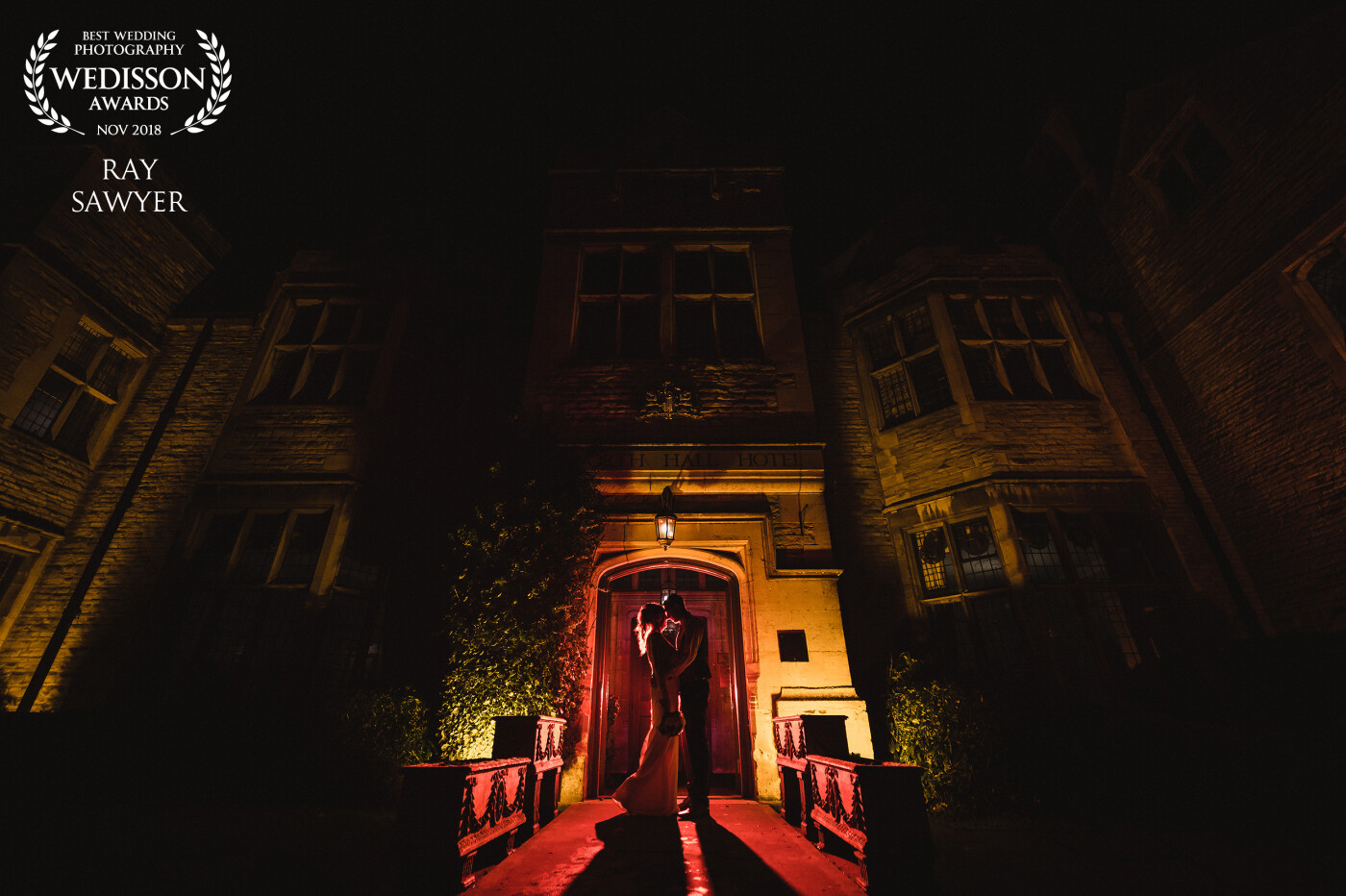 Captured at Redworth Hall Hotel. Vicky and Chris were great! They popped outside for about 5 minutes to create some sneak out photos and this was just one of them. I love the silhouette look framed by the doorway. A red gelled flash was placed behind them.