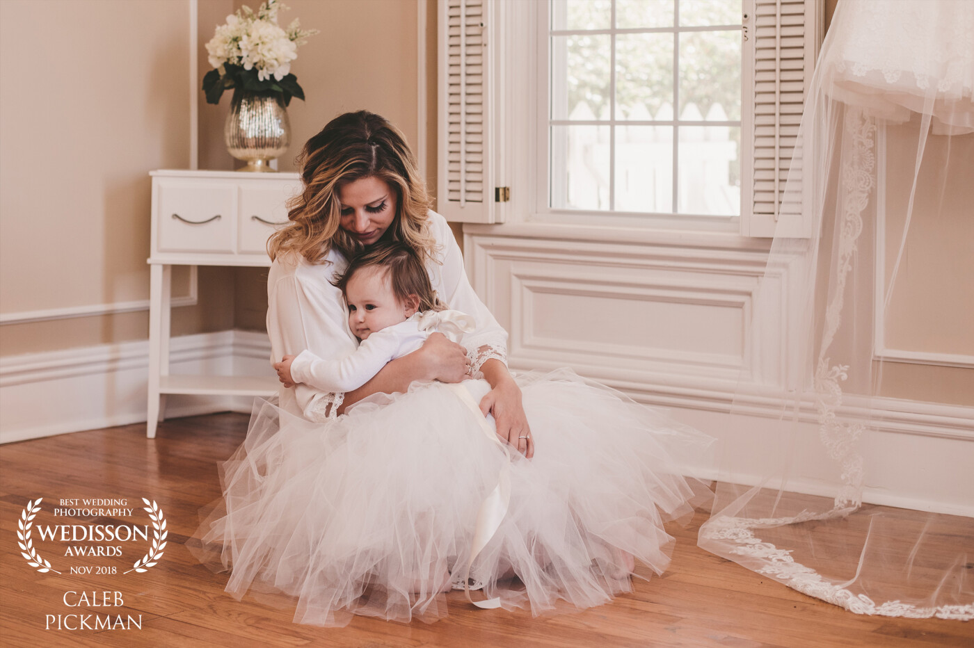Bride to be and her daughter cuddling up and admiring mom's dress! This moment is a once and a lifetime moment. This photo says it all.