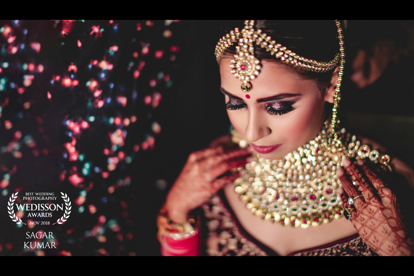 The colours in the frame when Vriti (the bride) was getting ready for her big day were overwhelming. Decoration lights in the background served as a perfect bokeh to complement the hues in Vriti's dress and jewellery.