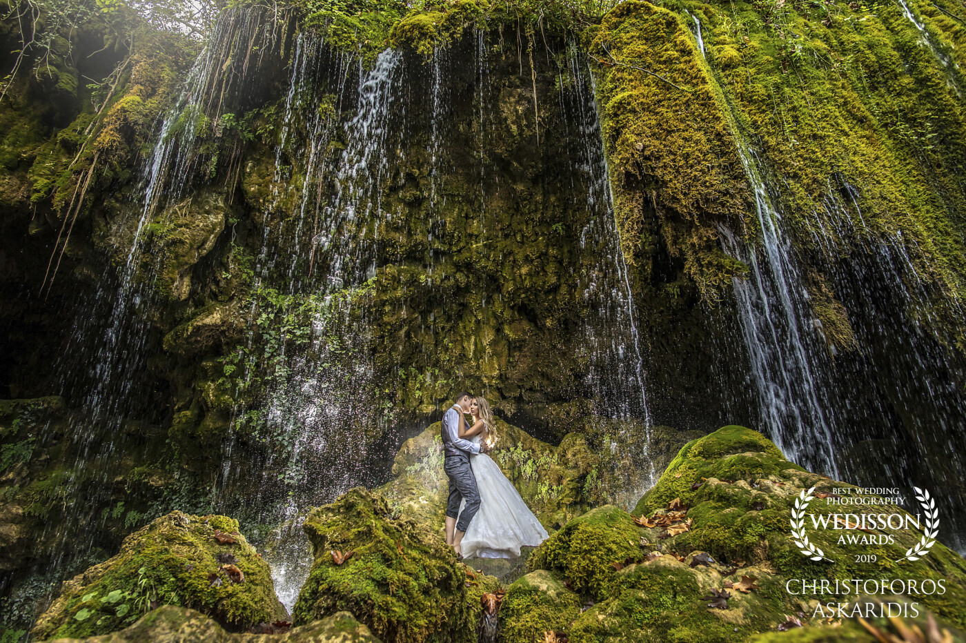 Vasilis & Eirilena, a beautiful couple. One of my favorite photos in Skra lake, Greece. After a long walk along the calm river you reach this breathtaking place. The result worth the effort! 