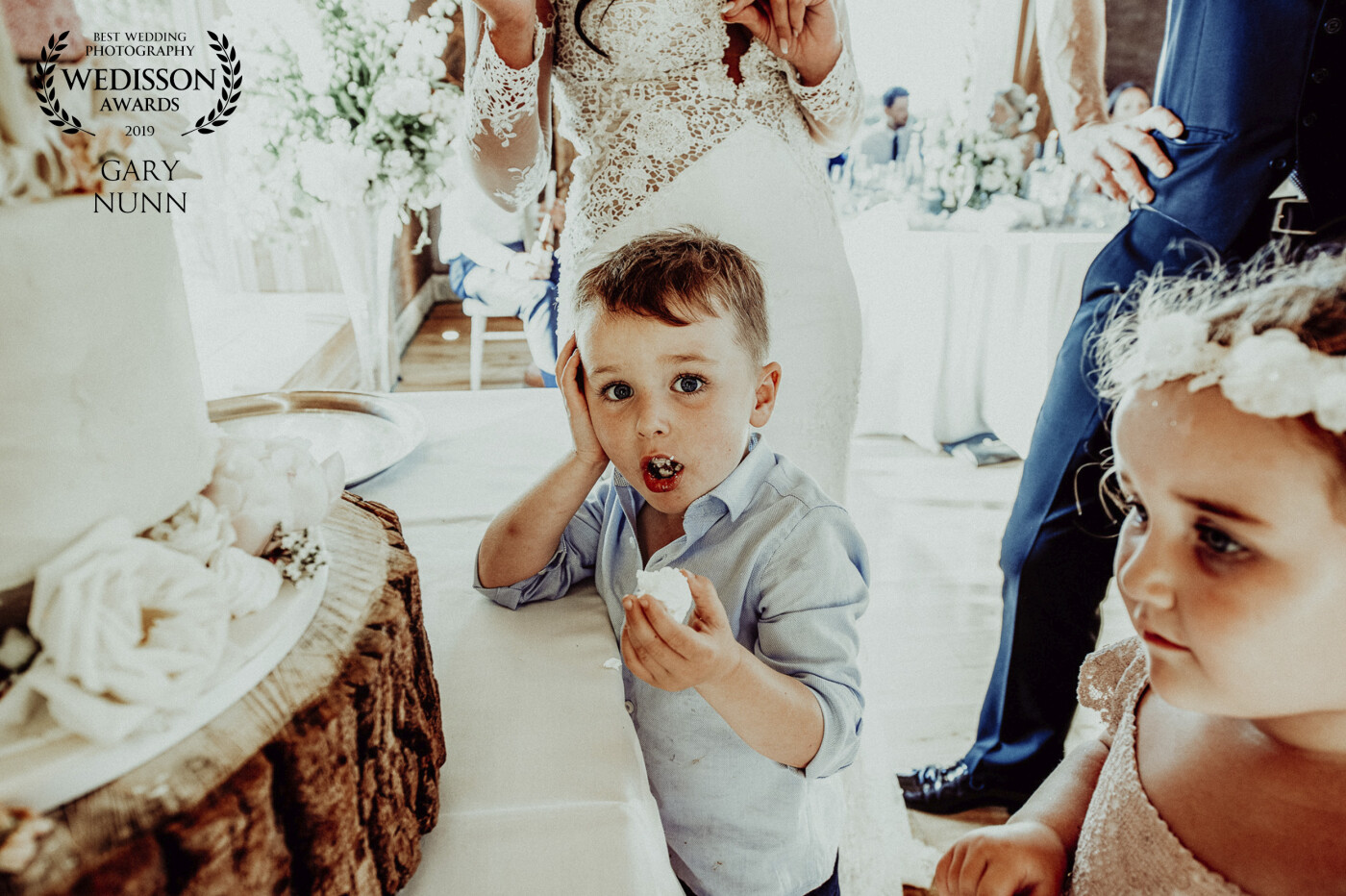 Another from Elmore Court in Gloucestershire. This young lad, the little boy of the bride and groom decided JUST before they are about to cut the cake to sneak a bit into his mouth....and I caught him red handed. 