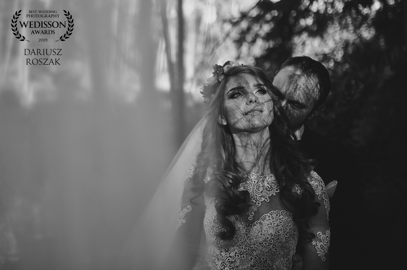 The photo was taken in a forest in Masuria (Poland). The amazing bride greatly facilitated the task of making a nice photo. The gentle sun that shone on the face through the branches probably did a nice job ;)