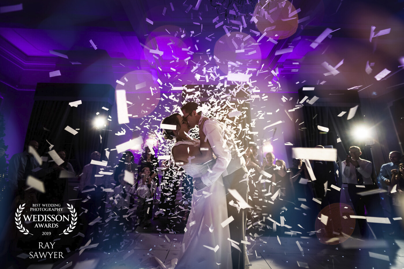 The DJ and I discussed when to set of the Confetti canons. I took some 1st dance shots and then quickly switched to a wide angle 14mm lens and crouched down ready for the canons. I knew exactly the beat of the song for when the were to explode so I locked focus on the couple and fired several shots and selected the best of the bunch. Everyone loved the confetti canons going off.
