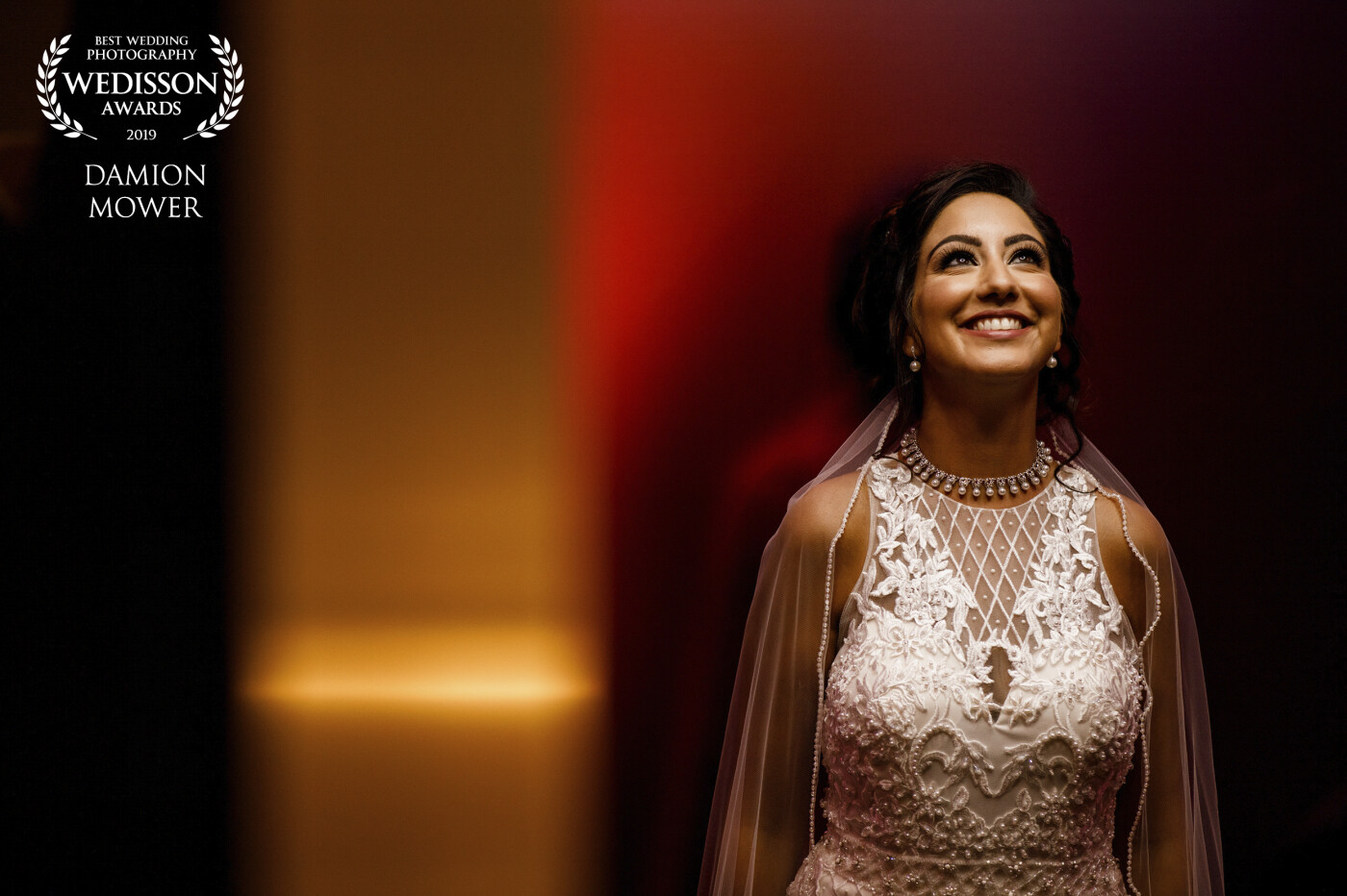 This was captured at a lovely Indian wedding late last year. <br />
The bridal shot was captured in a lift with the gold reflecting from the lift door as it closed and the red was the carpeted lift sides.