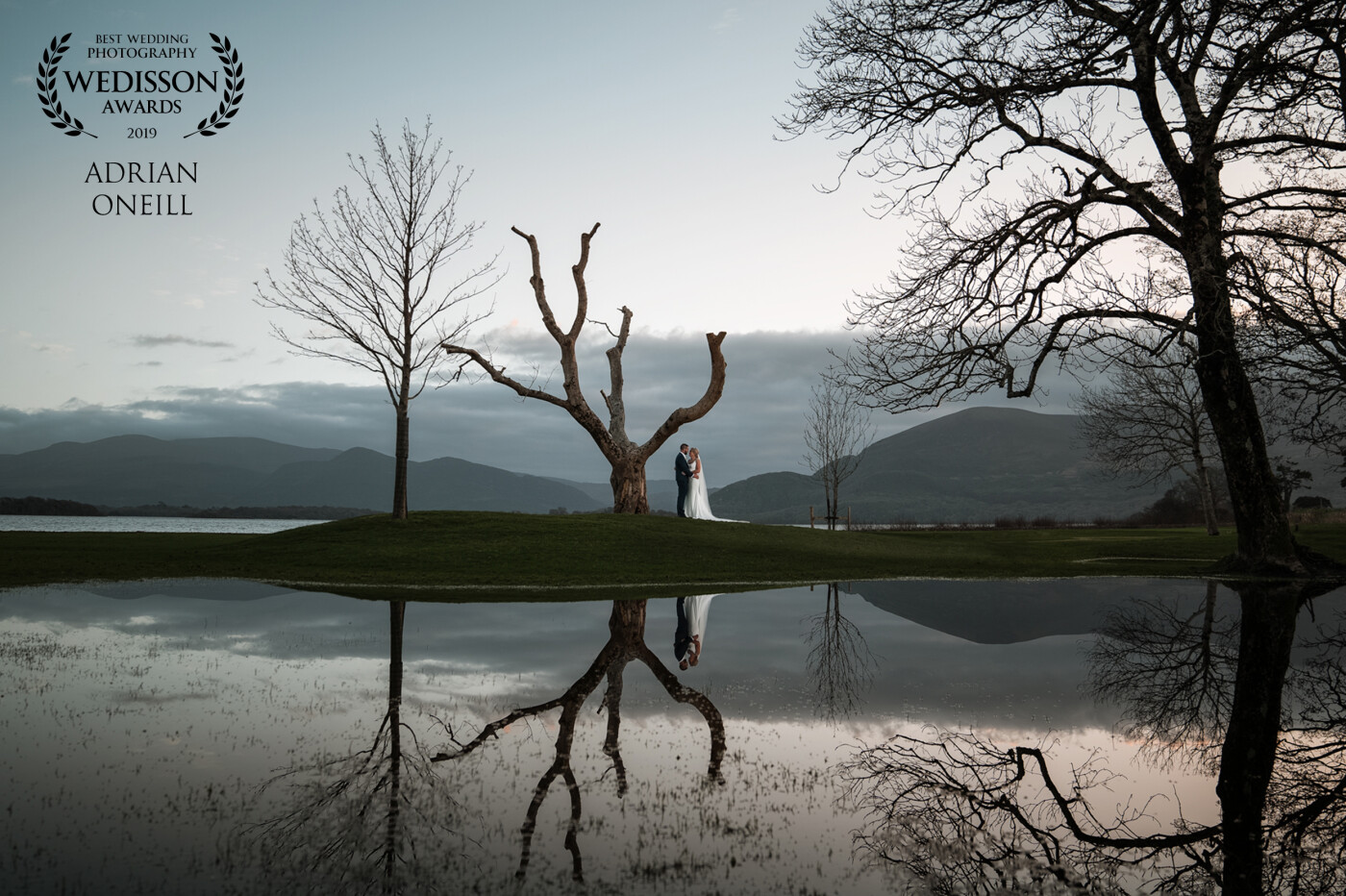 It was the day after a Storm and there were floods everywhere. I took full advantage and placed the couple in the perfect place so I could get a lovely reflection in the puddle. The reflection of the old tree just leads you to the couple, I love it!!!!