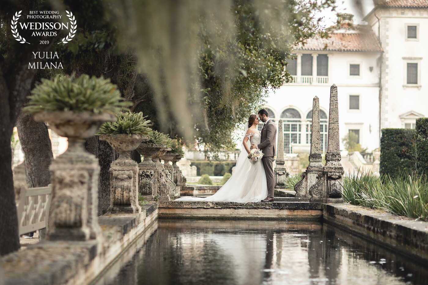 This photo was taken at the beautiful Villa Vizcaya in Miami, Florida. It was raining that day but I think the rain made it even more romantic and beautiful.
