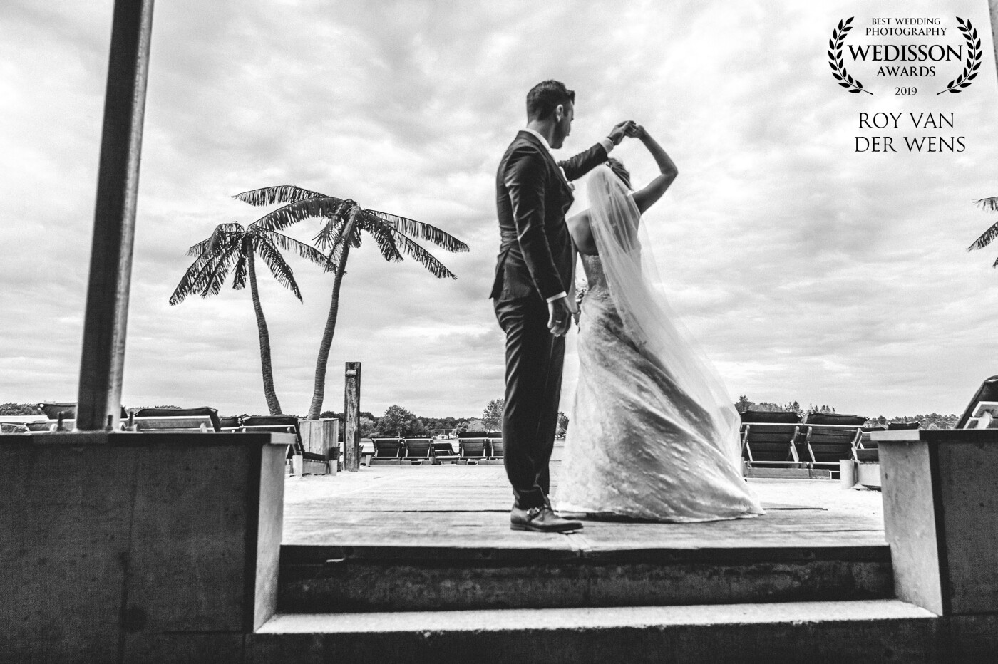 Beautiful bride and groom dancing on their wedding day at the beach. This photo was shot in black and white because it made the attention of the moment shift completely to the dancing bride and groom.