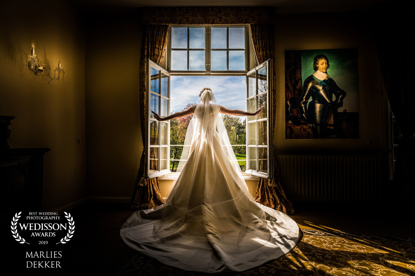 Just before the groom came in, she opened the window to check out where mister groom was outside at that moment...<br />
the light on the painting was perfect. It was like the guy on the painting was watching what was happening at that moment...  It took me just one click to make the magic happen! What a lovely bride!