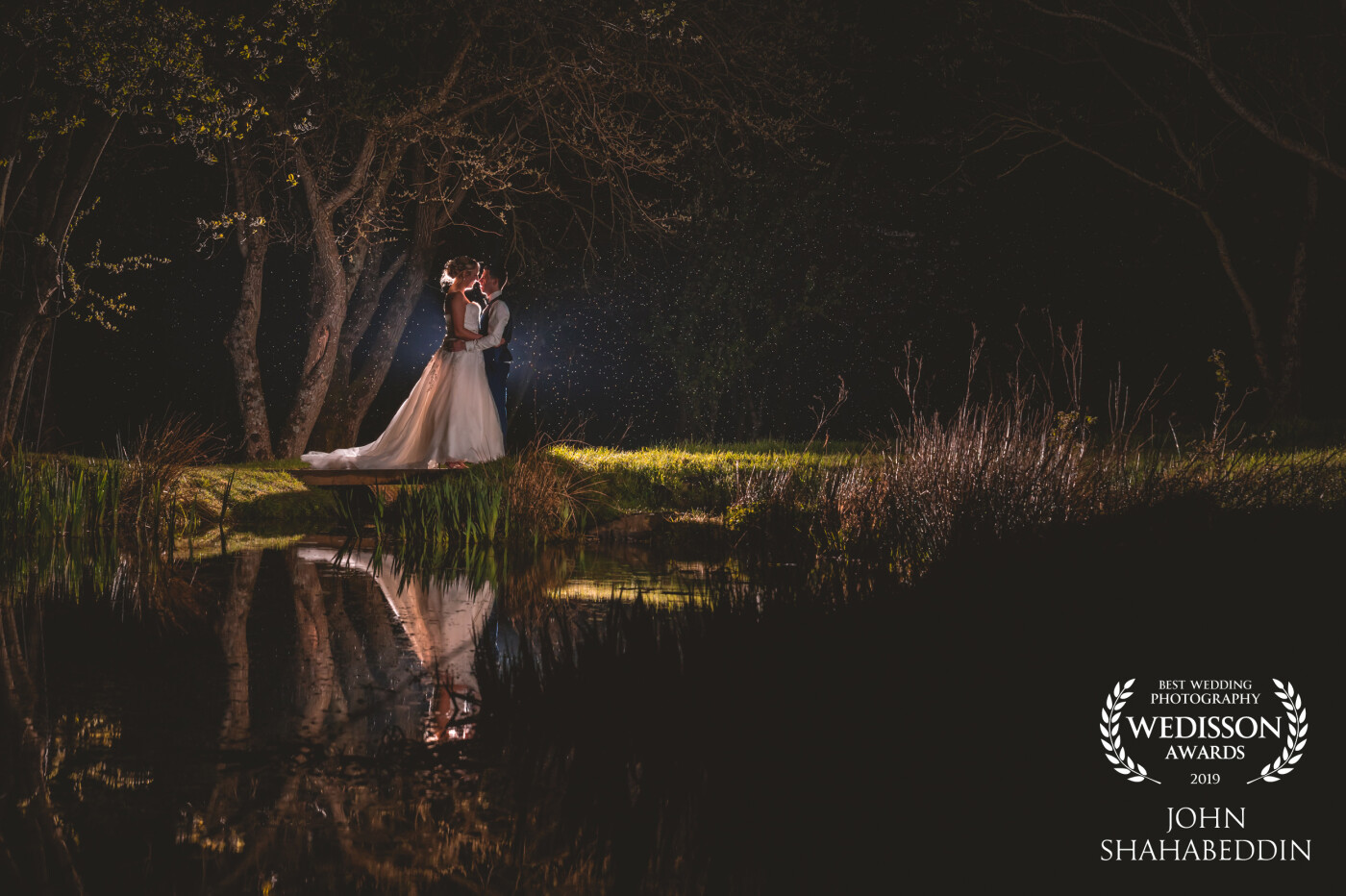 When exploring a beautiful country farm venue in the Lake District, UK, I just knew that this lake, with it's gorgeous little bridge and fairy tale setting, would need to be shot at night. I came back after dark with the couple in tow to capture it. "It was worth the wet toes!" the bride said after seeing the image. I wholeheartedly agree! 