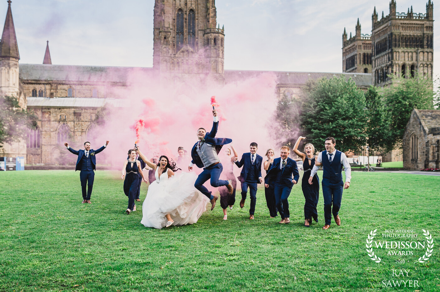 I brought a few smoke bombs with me to Sophie and Joe's wedding and before the reception started we heading out onto the cathedral green for some fun. Just before the bombs were exhausted I said to everyone run at me and jump in the air. They had so much fun. 