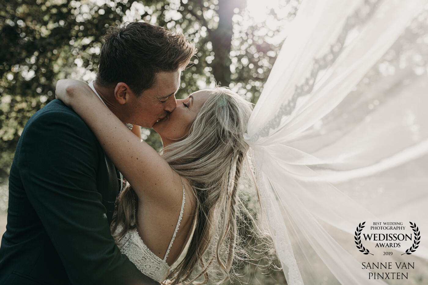 This beautiful picture we took in the last minutes of the shoot when this gorgeous light came between the trees. A beautiful couple, high school sweethearts and investing in a happy life together!