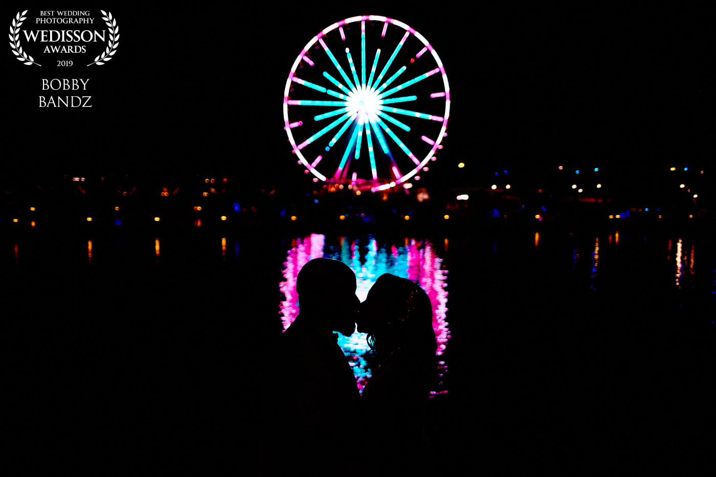 Last shot of the night and we ended up at National Harbor to finish it off. There are a bunch of cliche shots that are done here but I wanted to think outside the box and use the reflection of the iconic Ferris wheel as my focal point to draw the viewer's eye to my couple. Lucky for me even though it was a long night already the bride and groom gave me free rein to do what I felt like would look best and this is what I came up with! I think it was one of their favorite shots from the day and for me, that means the world!