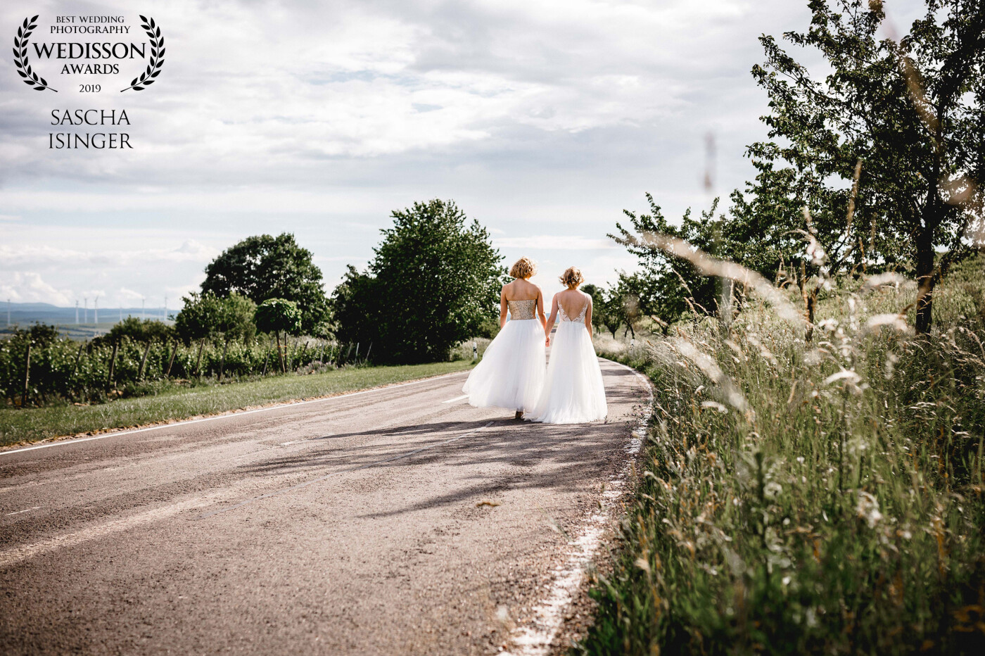 Walking down the street - hand in hand! These amazing two ladies got married 2 years ago in a wonderful winery in Rheinland-Pfalz. On our way to the main photo spot, I saw them, walking down the street like this. So I decided, that this could be the photo, they wanna have. 