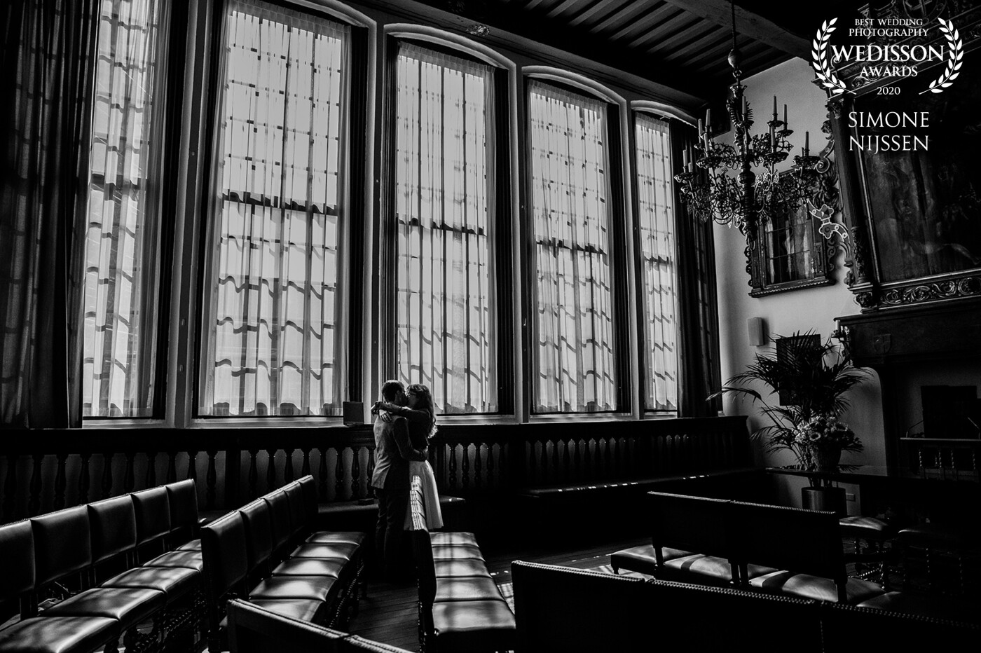 This was one of my most fun weddings in 2019. Very proud of this picture, made in one of the oldest and most beautiful rooms to get married in the city of Zwolle in The Netherlands. The bride and groom were hugging after the ceremony and didn't notice that I was still there to catch this beautiful moment between the two of them. 