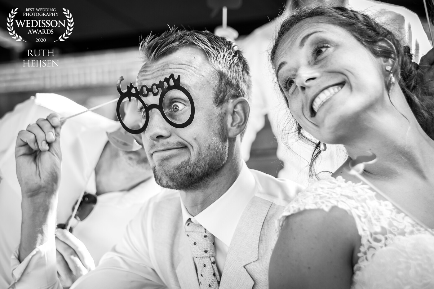 A photobooth makes you do funny things and make funny faces. This newlywed couple enjoyed it so much, they almost couldn't get enough of it!