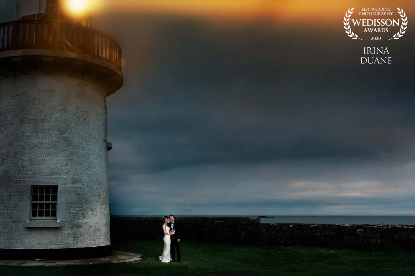 Ballinacourty Lighthouse offers an impressive and scenic backdrop. It located in the eastern Dungarvan Bay in county Waterford, Ireland and the first light flashed in 1858. When Sarah, the bride, asked me to photograph there I couldn't be more excited! I used a simple set up: one off-camera flash with a grid to highlight my couple. 