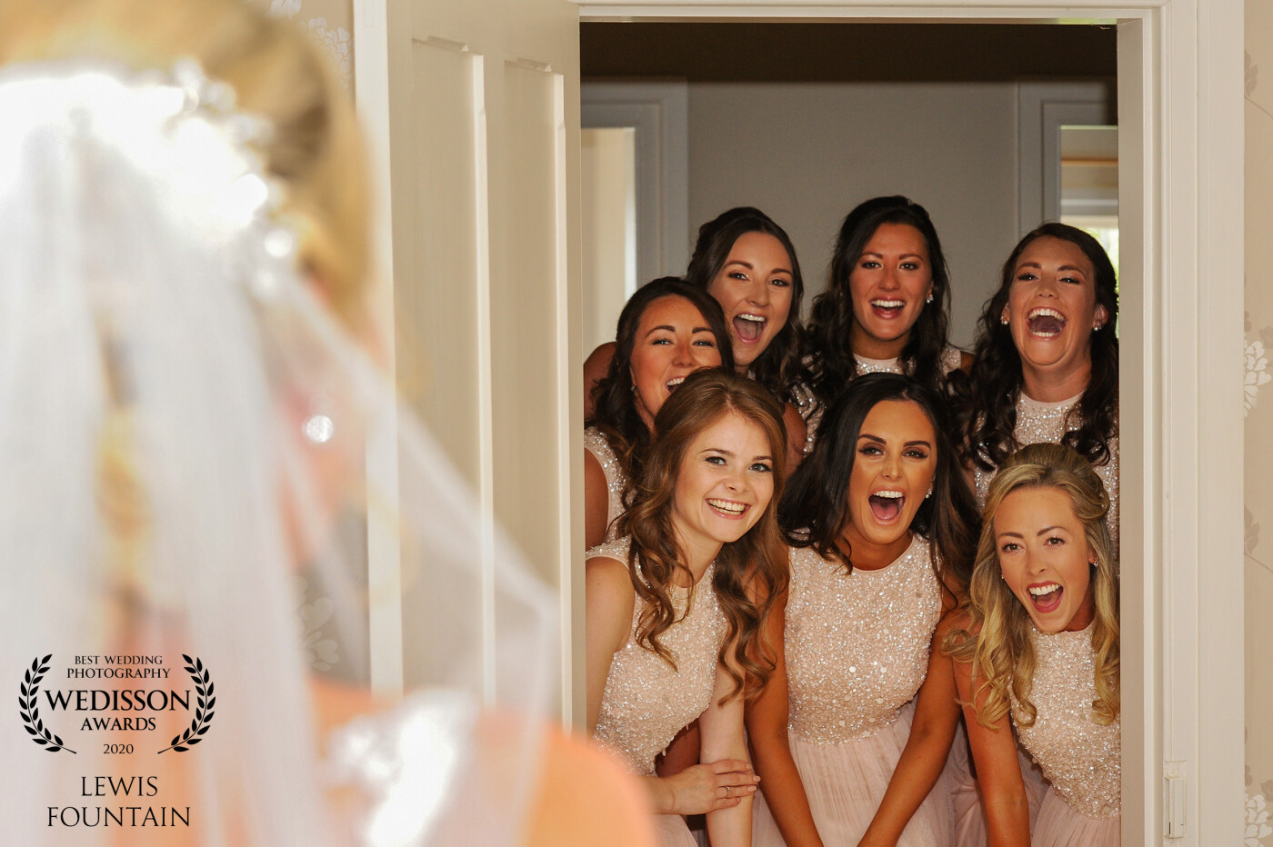A fun shot with our bride and her bridesmaids seeing her in the dress for the first time. This shot always gets a great reaction!
