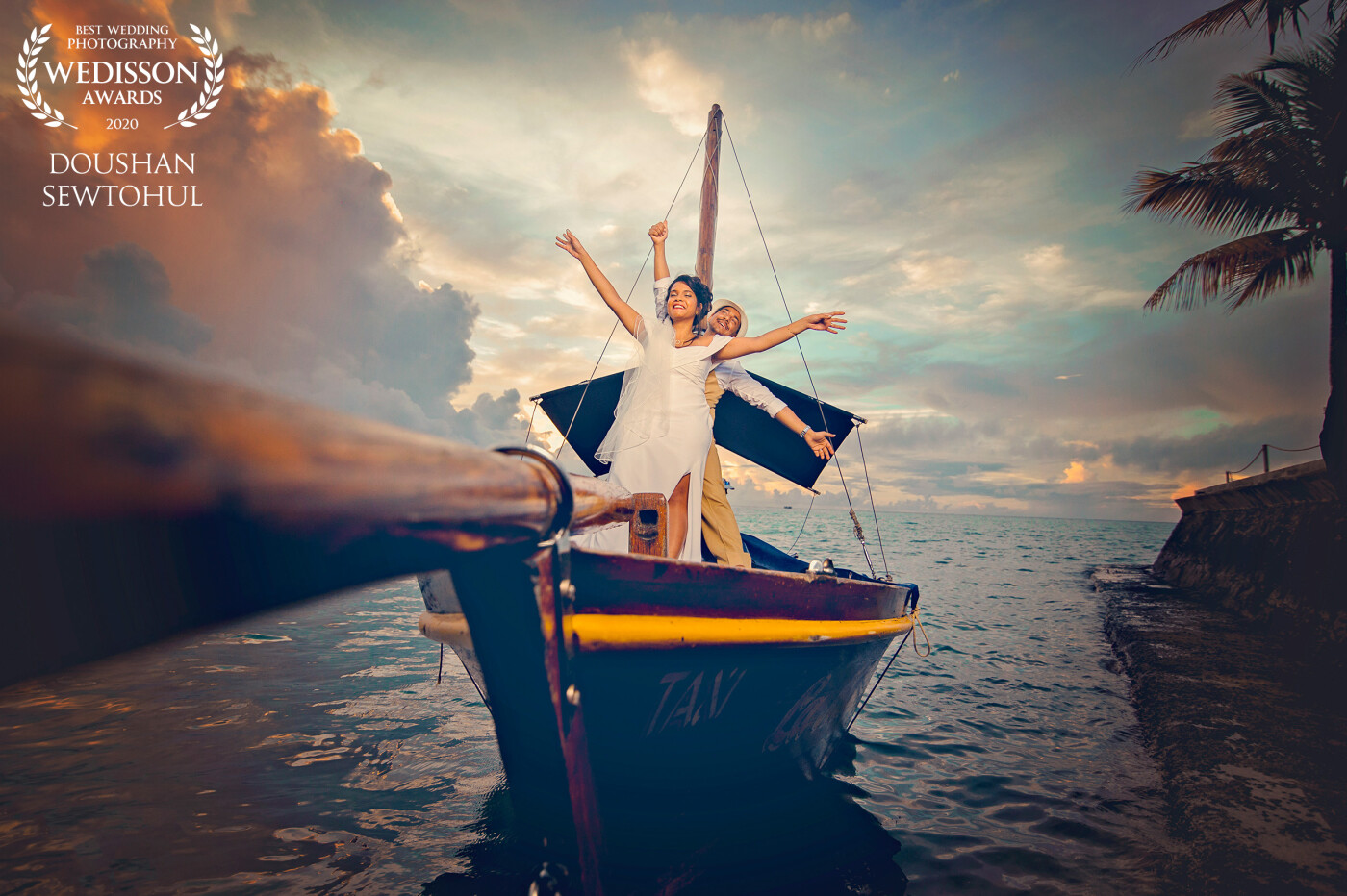 What A beautiful memory! the most waited moment. The grand entrance of the bride and groom. It was a destination wedding in the paradise island of Mauritius. The perspective of the boat inspired me to take this shot through that angle. Very difficult though with the moving boat.<br />
#Mauritius #Doushanarts<br />
www.doushanarts.com