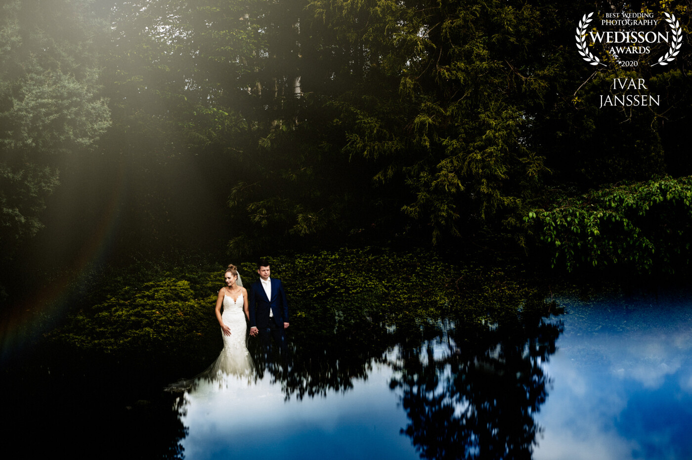 A lovely couple in the Netherlands. I would create a photo where it looks that the wedding dress seems to get one with water. With reflection, I created this photo.