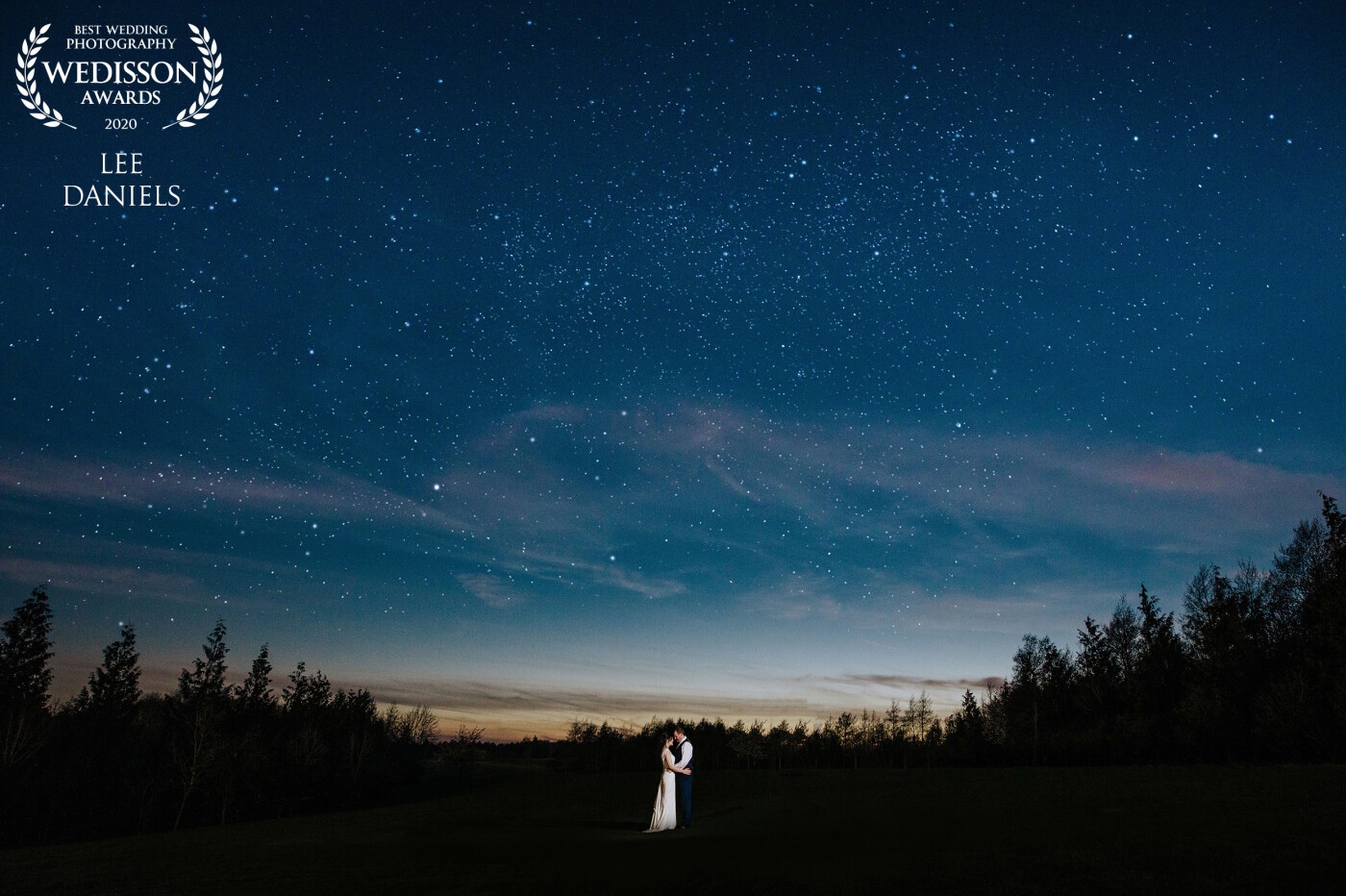 Golf courses have their benefits for wedding venues, the open space is great for after dark portraits. I found this composition that I like with the trees adding some texture to the image. I pulled out some stars with long exposure and a low powered burst of flash on Emma & Glenn made them pop. 