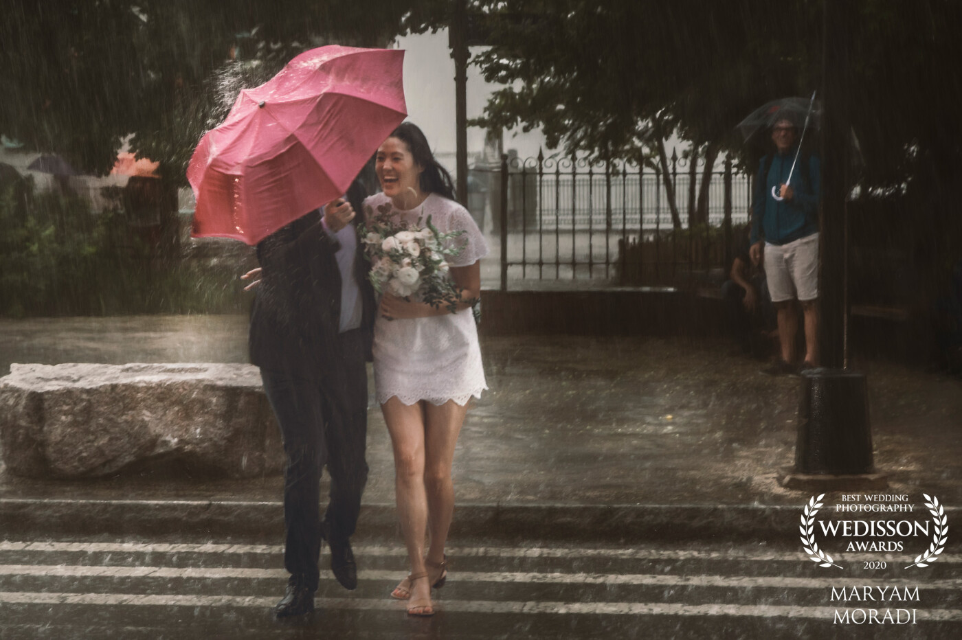 Love, Joy, and Rain Drops ... My gorgeous bride with her handsome groom enjoying the first moments of their marriage in harsh rainy weather at Brooklyn Bridge Park in New York City<br />
@marymor_photography<br />
New York City, US