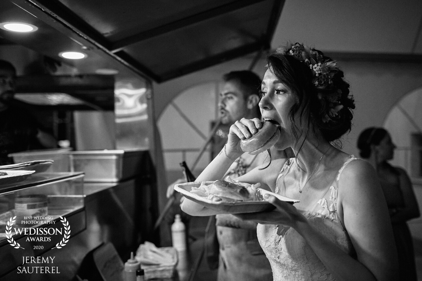 The bride and groom had planned a Food Truck evening for their wedding meal. The bride was very hungry and did not resist long before eating her burger.