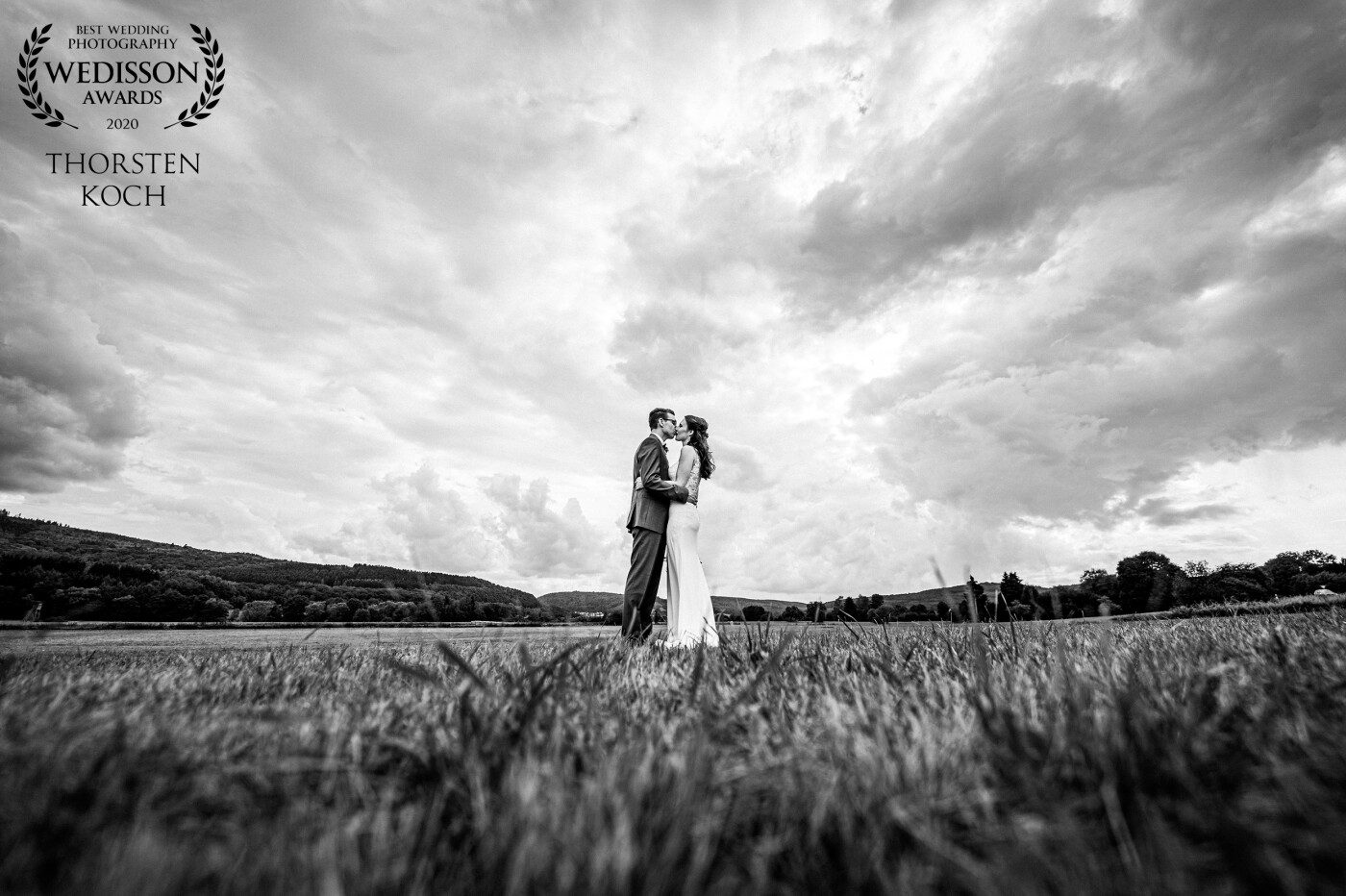 This award is very special to me because this was the first wedding this year that almost took place the way it was planned. We found this great wide area and I love cloudy skies... so we took this photo.