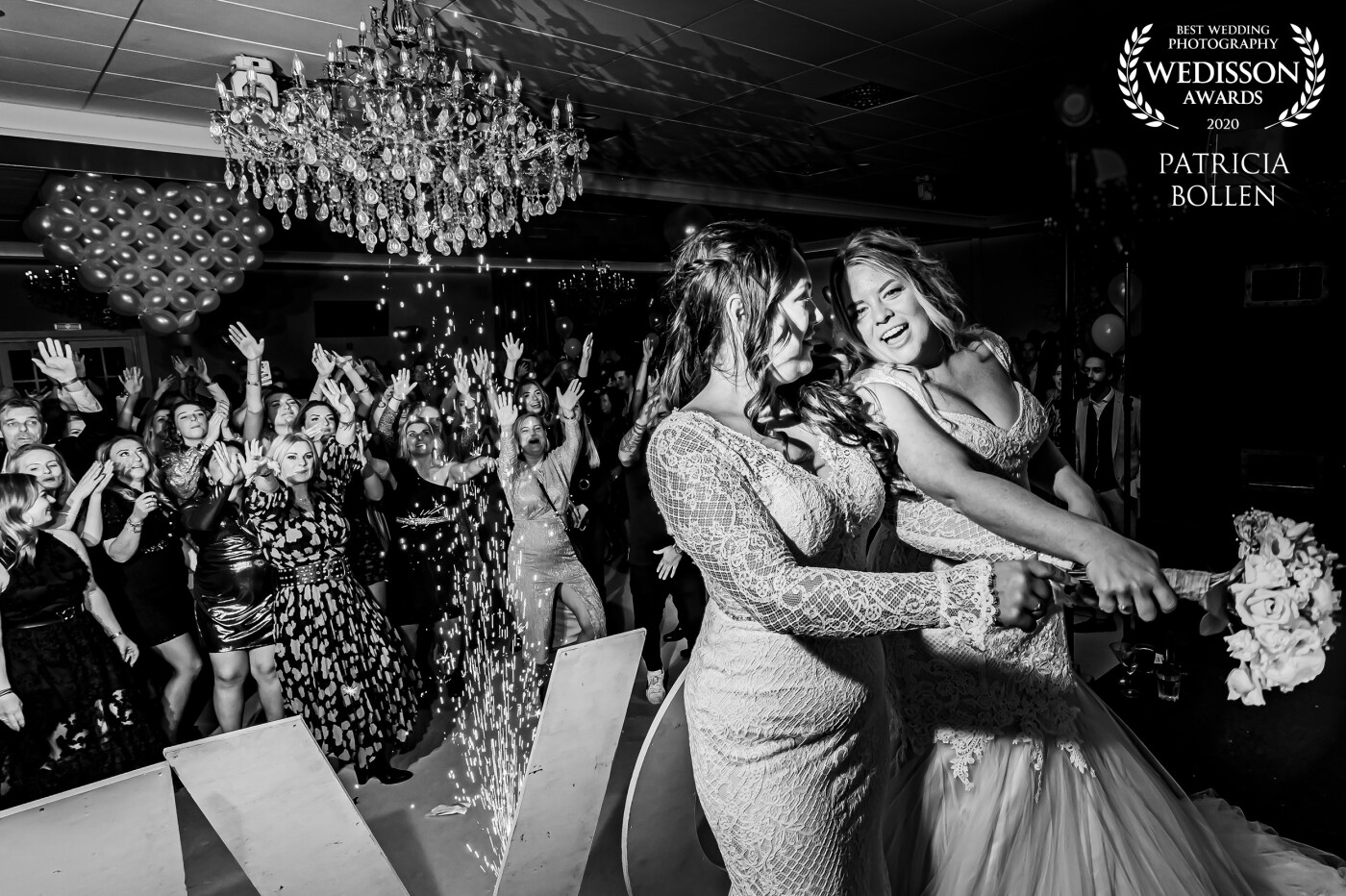I love party pics. I made this one January 2020, before COVID-19 blocked the parties. This wedding couple of two girls threw their flowers to the unmarried girls at the party. In this tradition, the lucky one who gets the flowers will be the next bride!