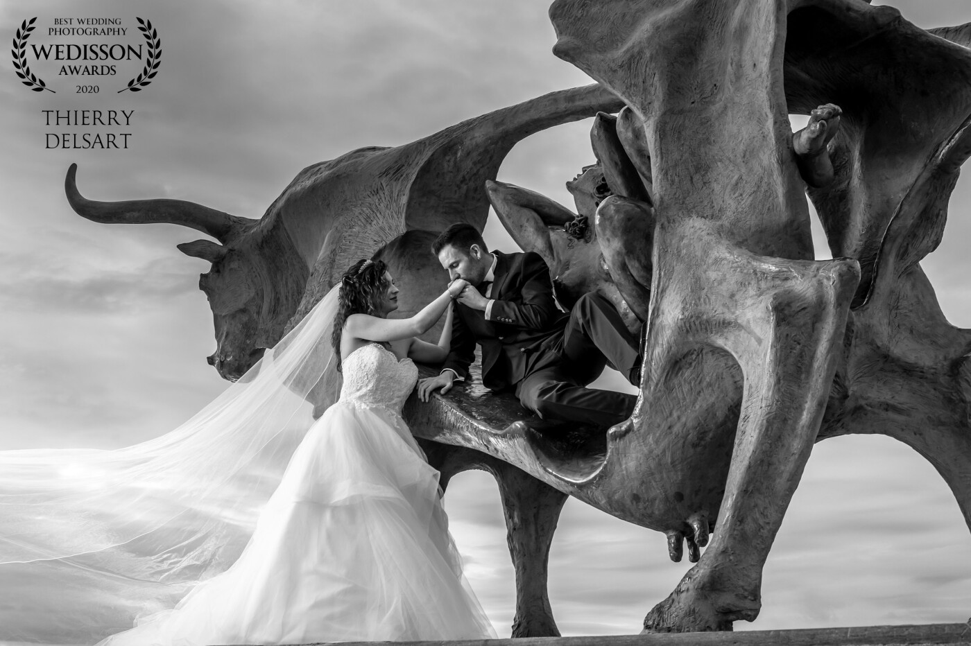 The storm was over the sea and gave us a beautiful sky. A wonderful Pasiphae sculpture is standing at the end of the breakwater ready to receive the groom that wanted to be in the cow's belly. Suddenly the magic happens when all three heads get aligned and the shooting angle gives majesty to it -helped by some sun rays and my flashes. This and all my wedding images would not be possible without the help and soul of my wife Eulàlia, the other photographer half of Mirall de Llum.