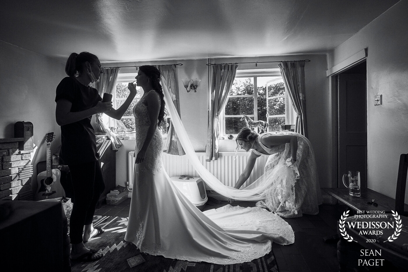 This was a beautiful moment of calm just before Natalie's and Mat's wedding earlier this year. Emily the wonderful bridesmaid quickly giving  Natalie's dress and veil a last-minute check before heading off to the church. 