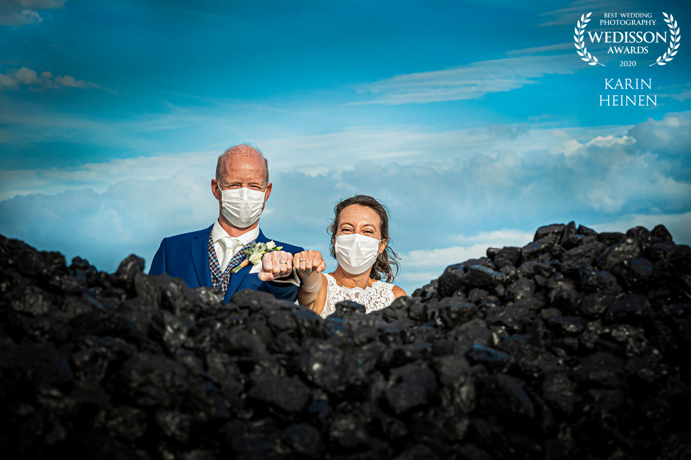 Covid-19...who hasn't heard of it? Although we had the honor of shooting about 40 weddings in 2020, this lovely couple was the first to gladly pose for a rough wedding shot with masks on. The pile of coal in the front adds a perfect contrast to the deep blue sky. Thanks so much to all at Wedisson for this 12th award. We are honored!