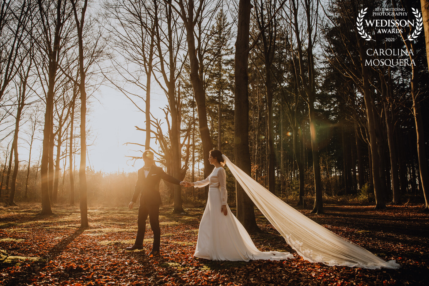 This wedding image is taken two weeks ago at a Belgian civil wedding. We have been waiting for a beautiful sunset to take wedding pictures. Such a stunning dress, veil...We are in love with this one.