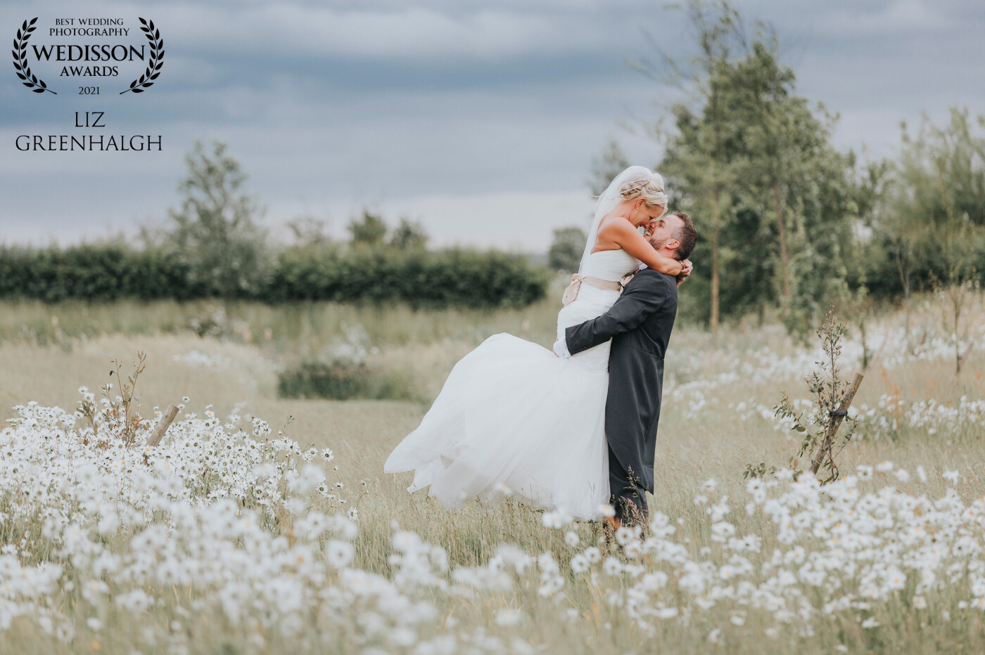 This was taken at one of my all-time favourite wedding venues, South Farm, Royston, Cambridgeshire, UK.  There is a wildflower meadow that has the most beautiful daisies.  I don't think Aby & Steve stopped smiling all day. 