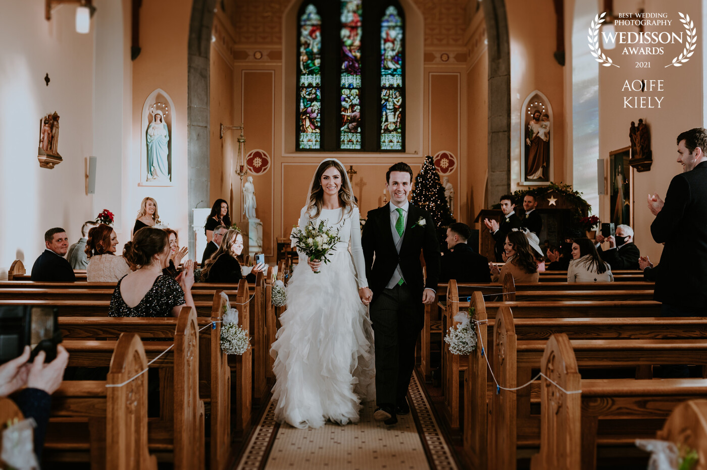 John & Deirdre walking down the aisle as husband & wife. They both planned the wedding in less than a week and it was absolutely stunning!