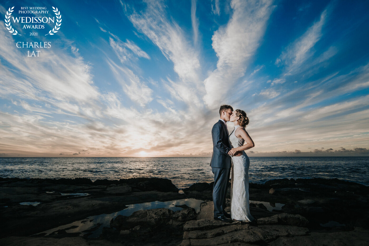 After a daytime Hawaii wedding and reception, Paul and Stephanie snuck away to a quiet beach on Oahu to share a private moment and we were able to capture this beautiful and special moment between them.