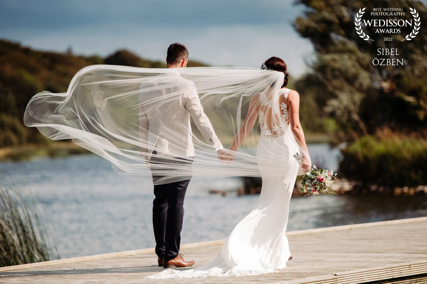This was a wedding we shot in a magical Irish venue in Co. Tipperary, in Ireland. Truly like a place straight from a fairytale. On this August day the warm summer breeze gently lifted our beautiful bride's vale and like it was held by fairies it floated behind our couple as they walked hand in hand on the jetty. 
