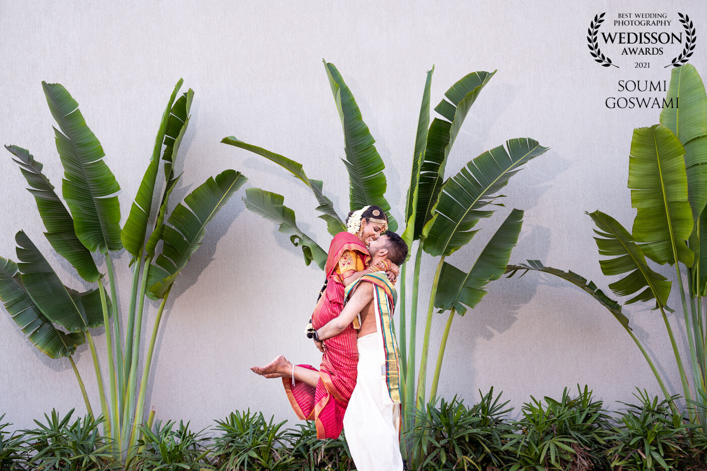 This was right after Deepak & Pooja's wedding. With banana trees in the backdrop and their authentic wedding attire, I knew this was going to be the perfect spot, but only became epic when Deepak lifted Pooja. Simply love this one :)