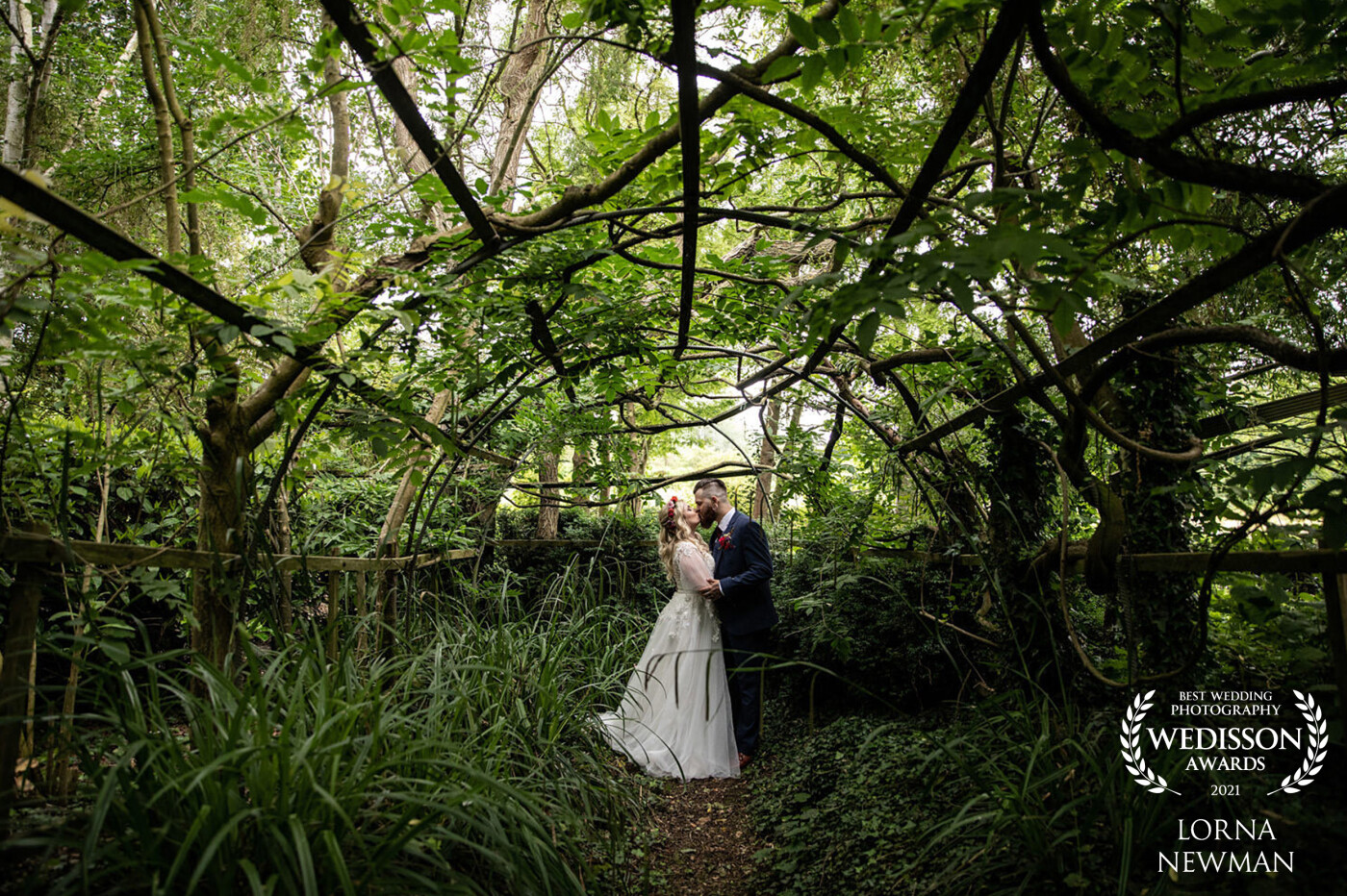 A Shot from Jessica & Sam's wedding in the Polytunnel at the beautiful Flaxbourne Gardens, this time of year it is covered in Wisteria and looks absolutely enchanting so we had to pop in for a shot.