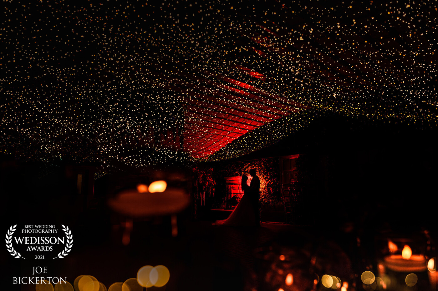 Delamere Manor in Cheshire has a beautiful fairy light ceiling curtain and I used this and an OCF with a red gel to create this silhouette of Charlotte & John - shooting through some candles to create the foreground bokeh.