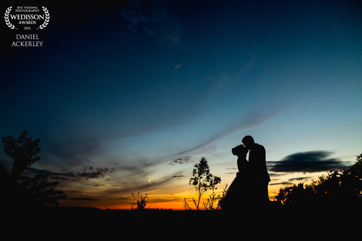 Alice and Robbie really wanted a wide shot that showed off the beautiful East Anglian skies where they got married, and although it had been overcast all day, as the evening drew in the clouds cleared and we had an epic colour show to use for this silhouette photograph.