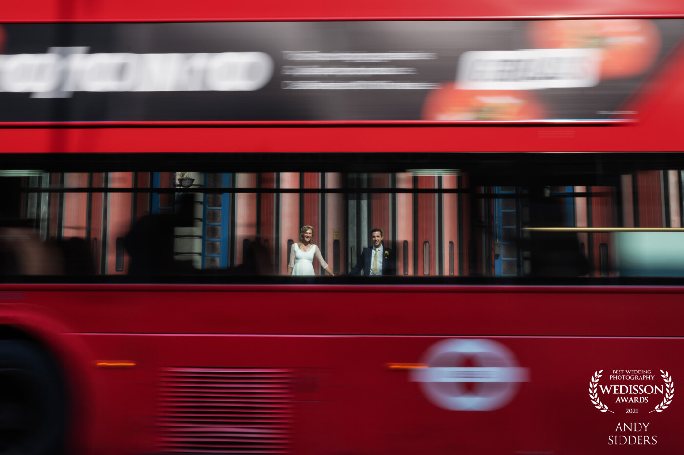 This shot was taken in front of Islington Fire Station after an Islington Town Hall wedding. I posed the couple and shot them using a slow shutter speed to capture the motion blur of the bus as it went past.