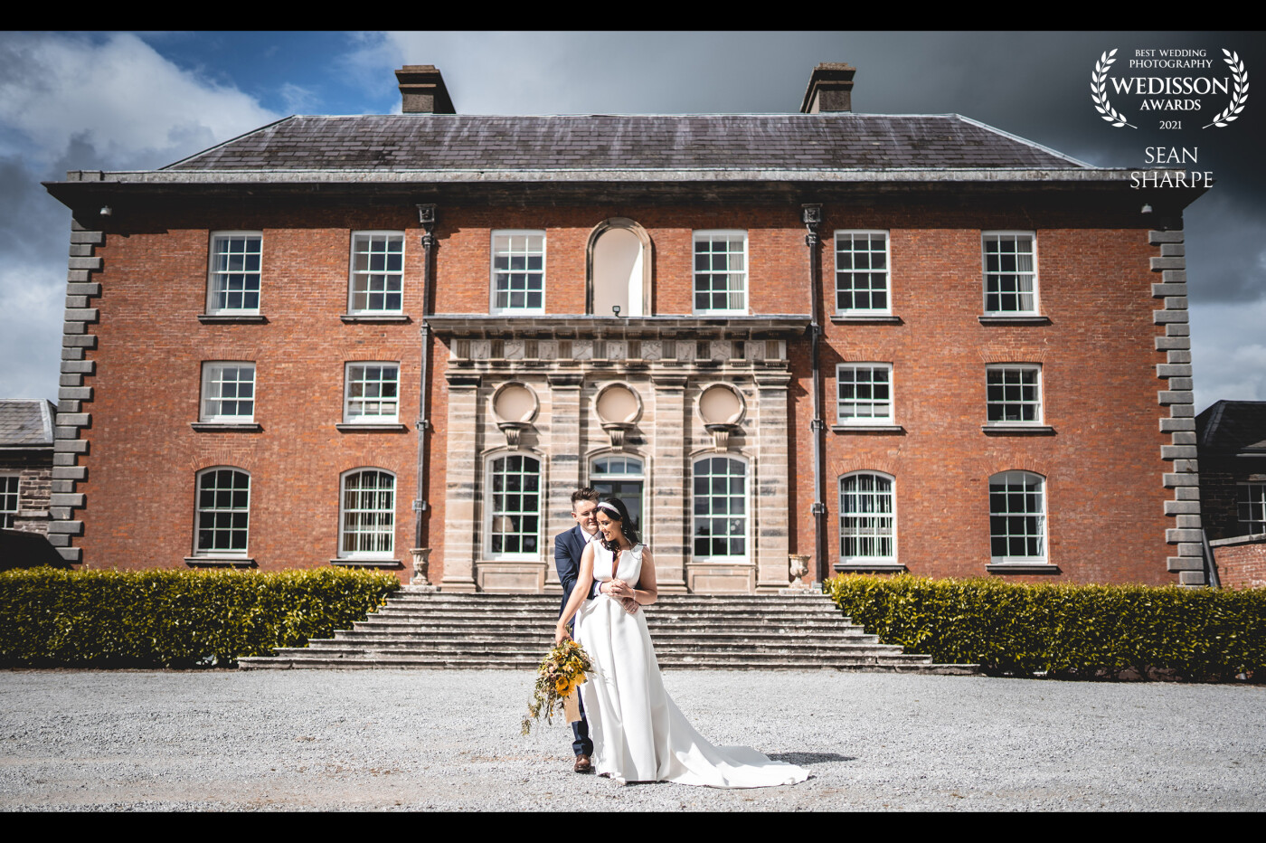 Not many people get the shoot their weddings at the beautiful Kilshannig Stud Farm, Co. Cork! We were one of the lucky ones! With a day filled of heavy rain downpours, the sun came out strong and completely lit the house and couple up just long enough to get the shot.