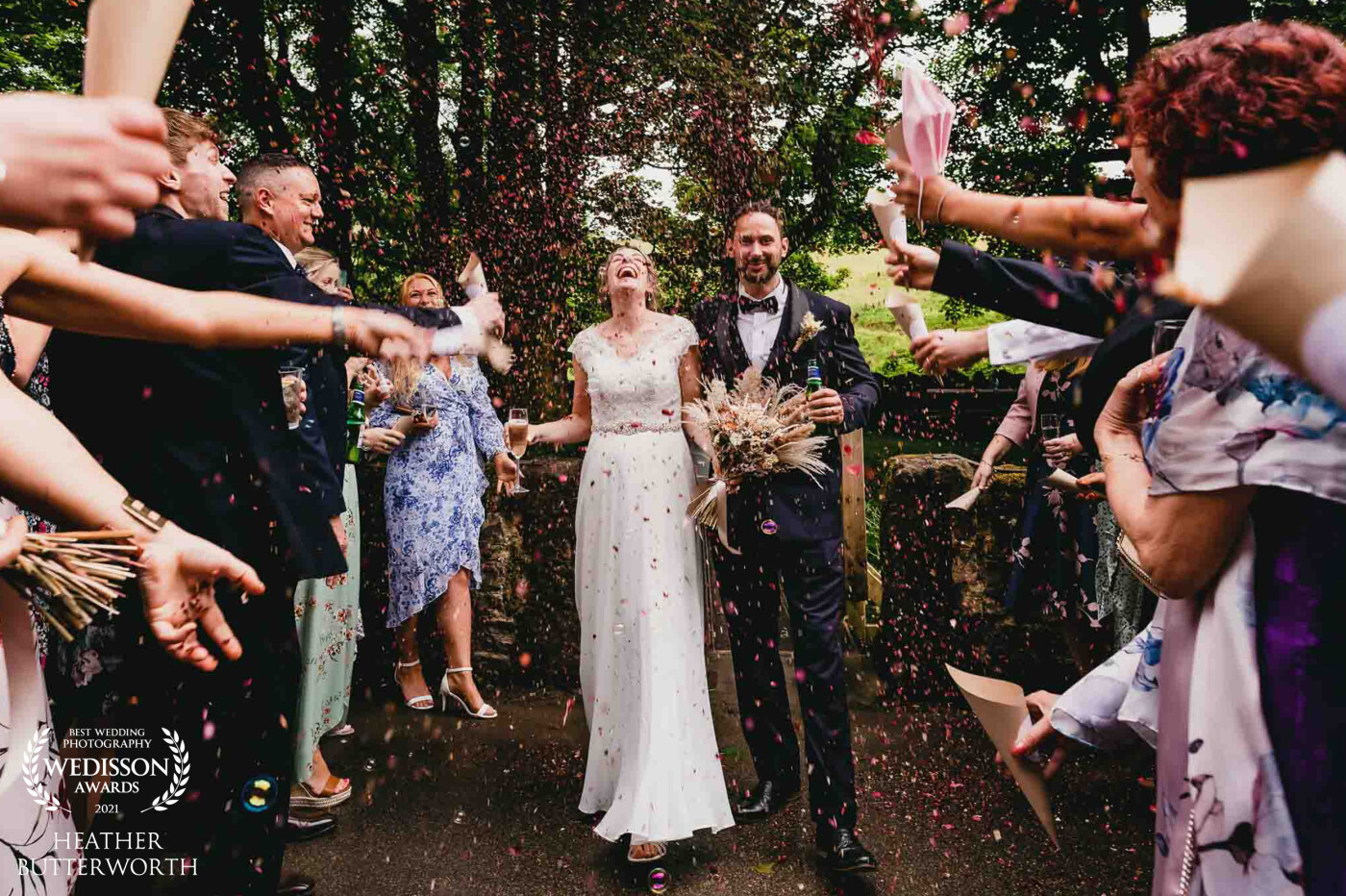 Lyndsey and Ashley were the first couple to get married at the beautiful new wedding venue Ponden Mill near Haworth in Yorkshire. They had had to postpone their day due to the covid pandemic and were determined to have some fun with their close family and friends. Lyndsey's face says it all on this photo! Pure ecstatic joy! A brilliant in the moment capture while confetti was thrown that totally sums up the feeling on the day.