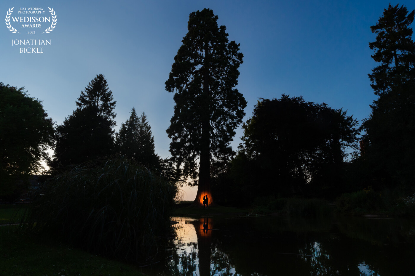 I captured this portrait during an engagement shoot in Tring. I saw the opportunity to get a reflection in the pond but the natural light wasn’t great so I used flash behind the couple to make the circle of light and under exposure the scene.