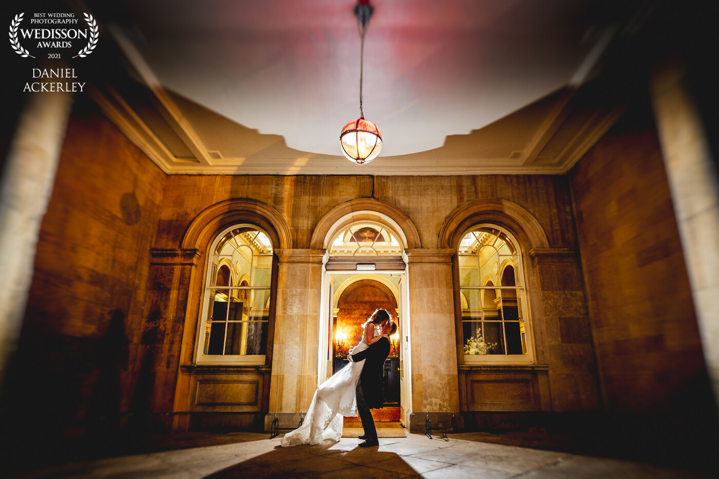 Nicola and Andrew had an amazing day, the weather was poor though, so after waiting as long as we could to get a sunset that didn't happen, we decided instead to get creative and use some off camera flash and this awesome venue door to get something romantic and dramatic.