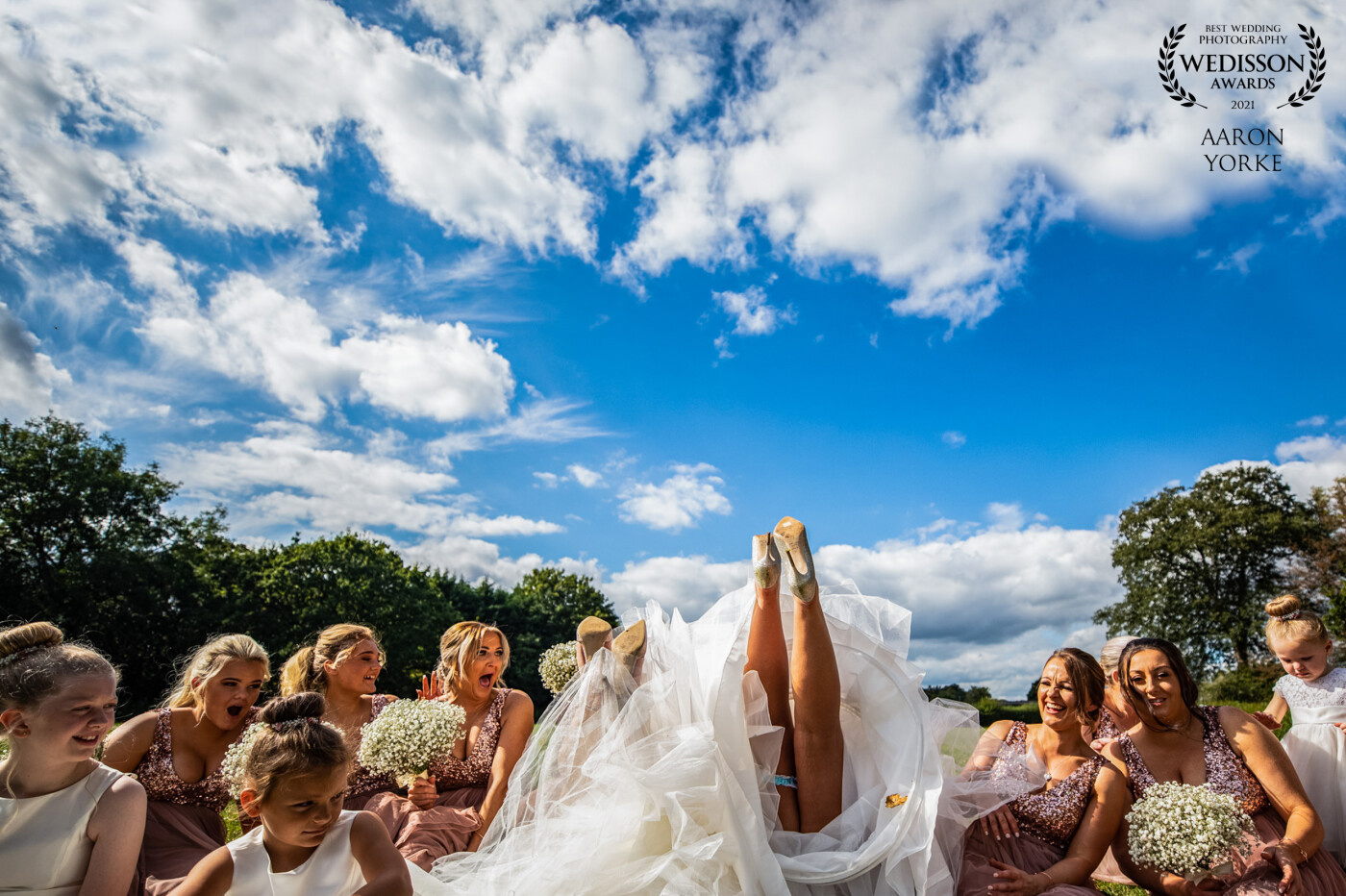 This wedding image was shot at the beautiful Stanbrook Abbey in Worcestershire. There is a small hill at the back and this image was taken as the bride and her party were waiting for the groom to arrive! They were so much fun and I enjoyed this wedding so much!
