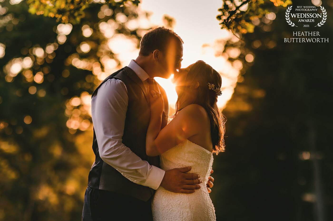 Laura and Andy's beautiful wedding day at Bowcliffe Hall in Yorkshire finished with a stunning golden sunset after a cloud filled day. Laura was game for climbing over a gate and into a field filled with sheep to get this photo just before the sunset and it was totally worth it!