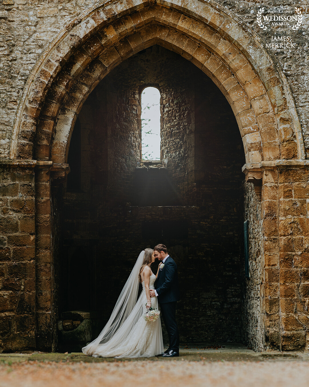 Taken at Ettingham Park Hotel in the UK, the venue has the most stunning grounds and old church ruins. This huge open arch way was perfect for a portrait shot.