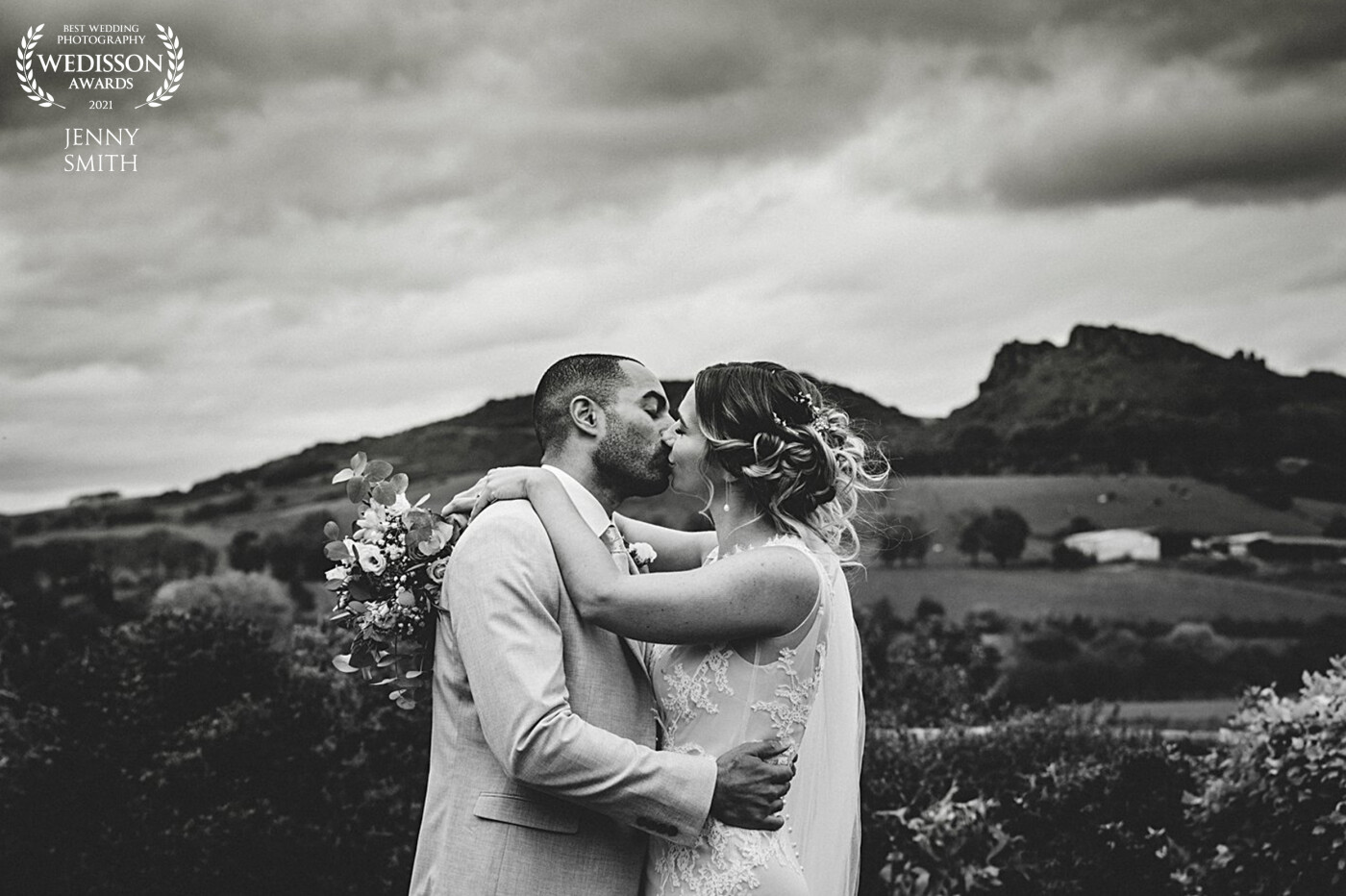Sarah & Ben are keen climbers - this photo captures them on their wedding day in front of the Roaches which is a place special to them.